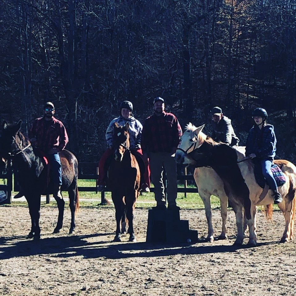 Group of adults riding horses